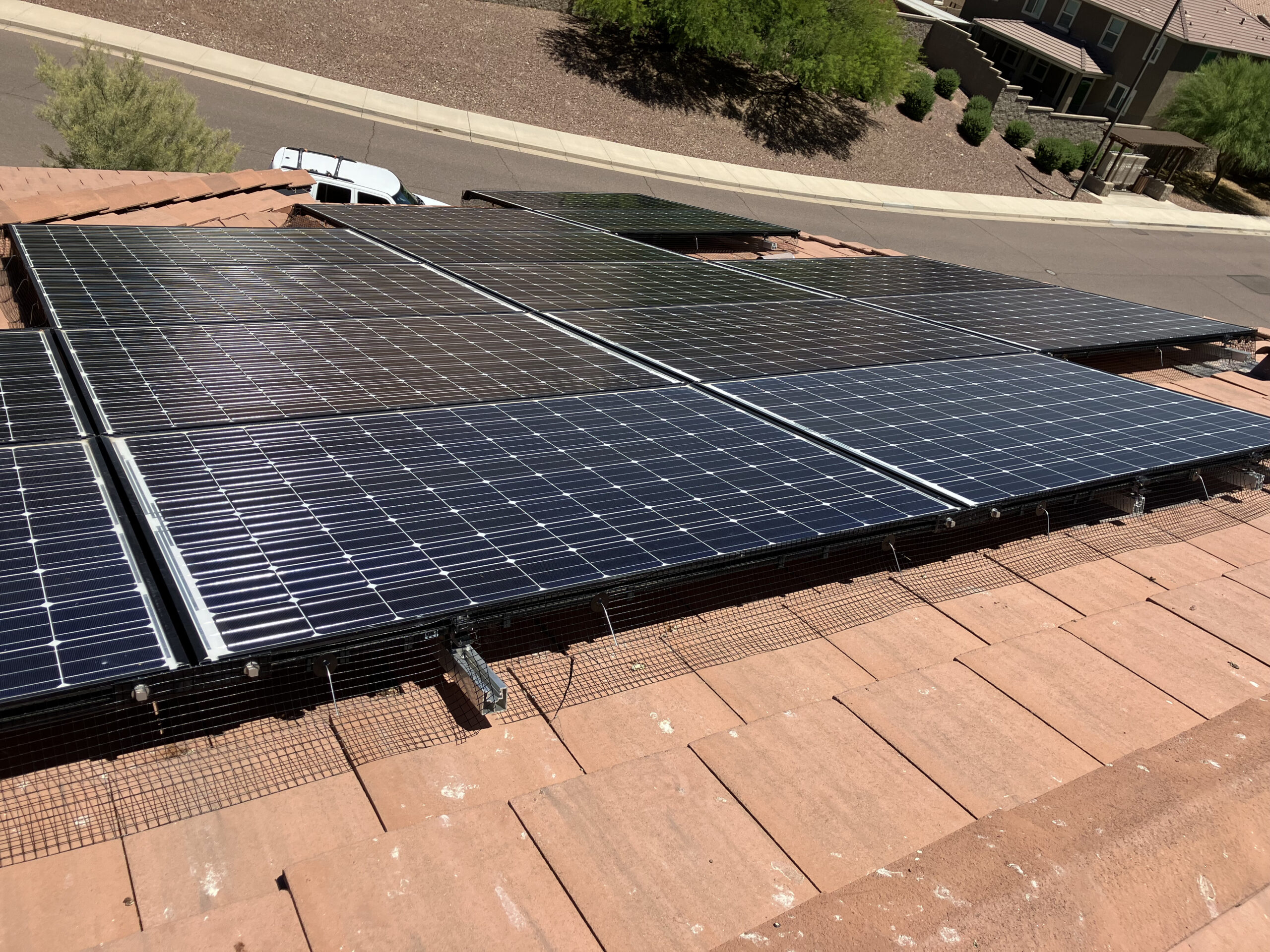Completed solar panel bird proofing installation with Completed Solar Panel Bird Mesh Kits Goodyear AZ installation with stainless steel mesh on a Phoenix rooftop.steel mesh in Phoenix AZ.