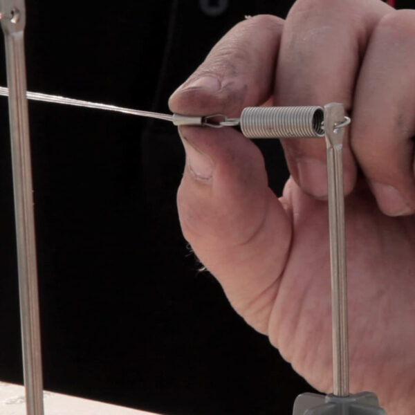 DePalma's large stainless steel tension springs for maintaining optimal tension in bird wire systems.